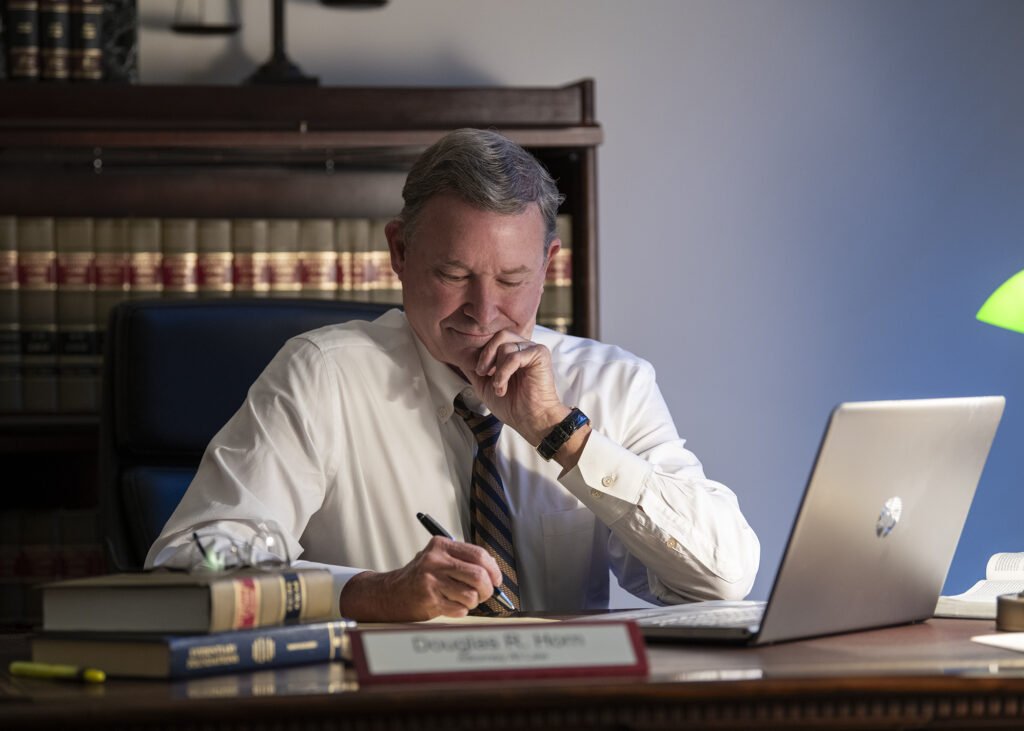 Kansas City lawyer Doug Horn reviewing a motor vehicle accident case